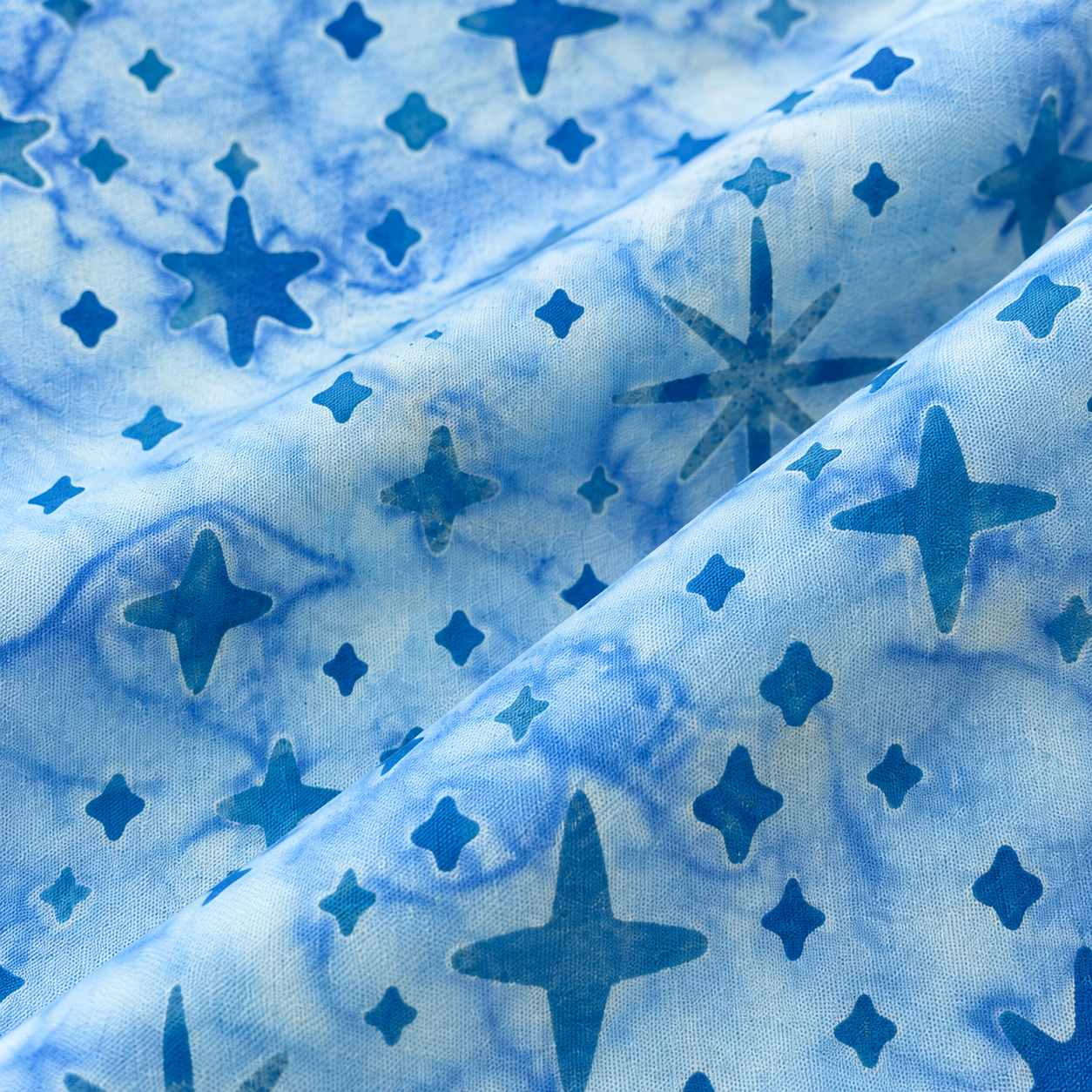 Tela batik algodón 100% estrellas azules, fondo agua