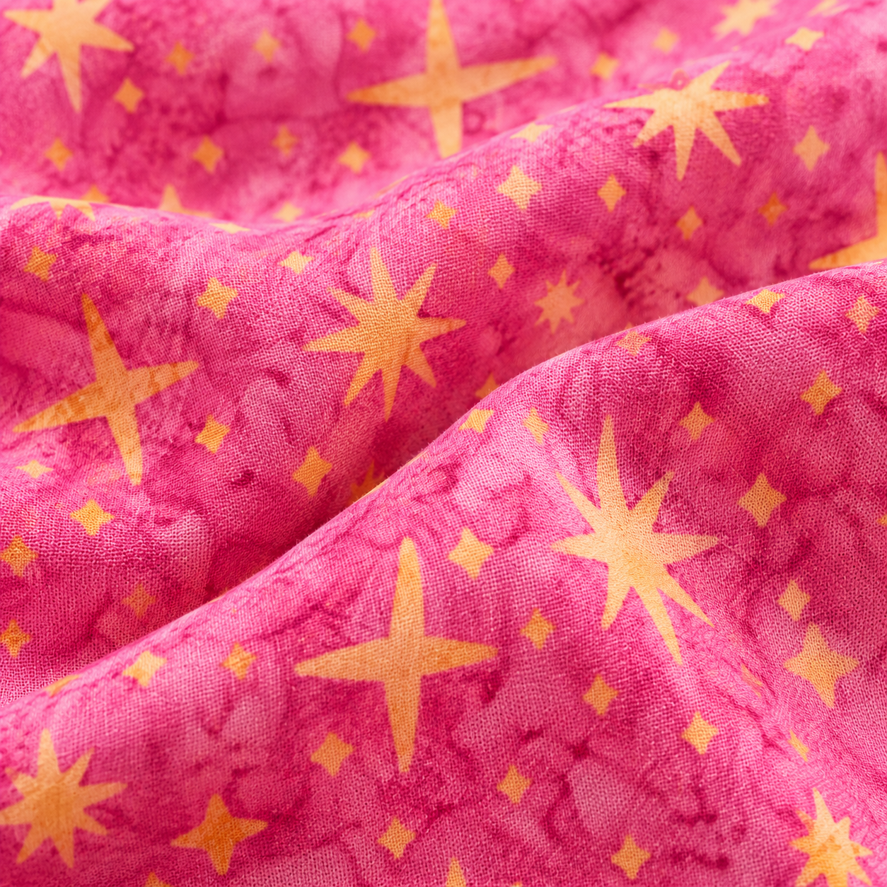 Tela batik algodón 100% fondo fucsia estrellas doradas