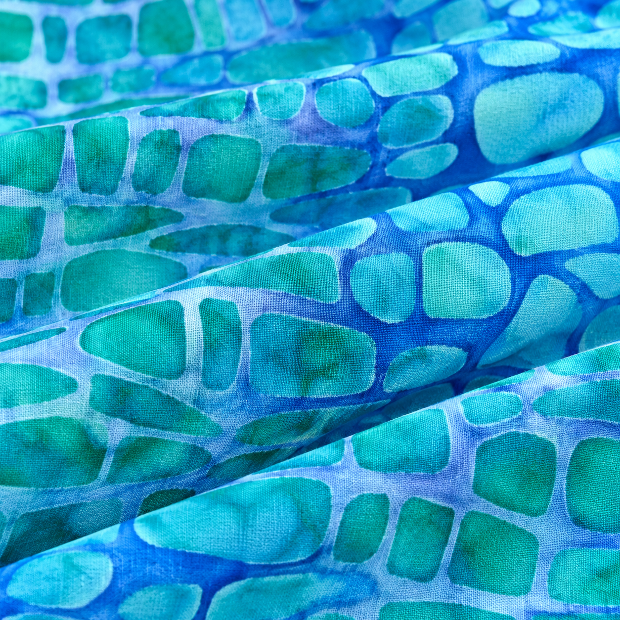Tela batik algodón fondo turquesa formas azules