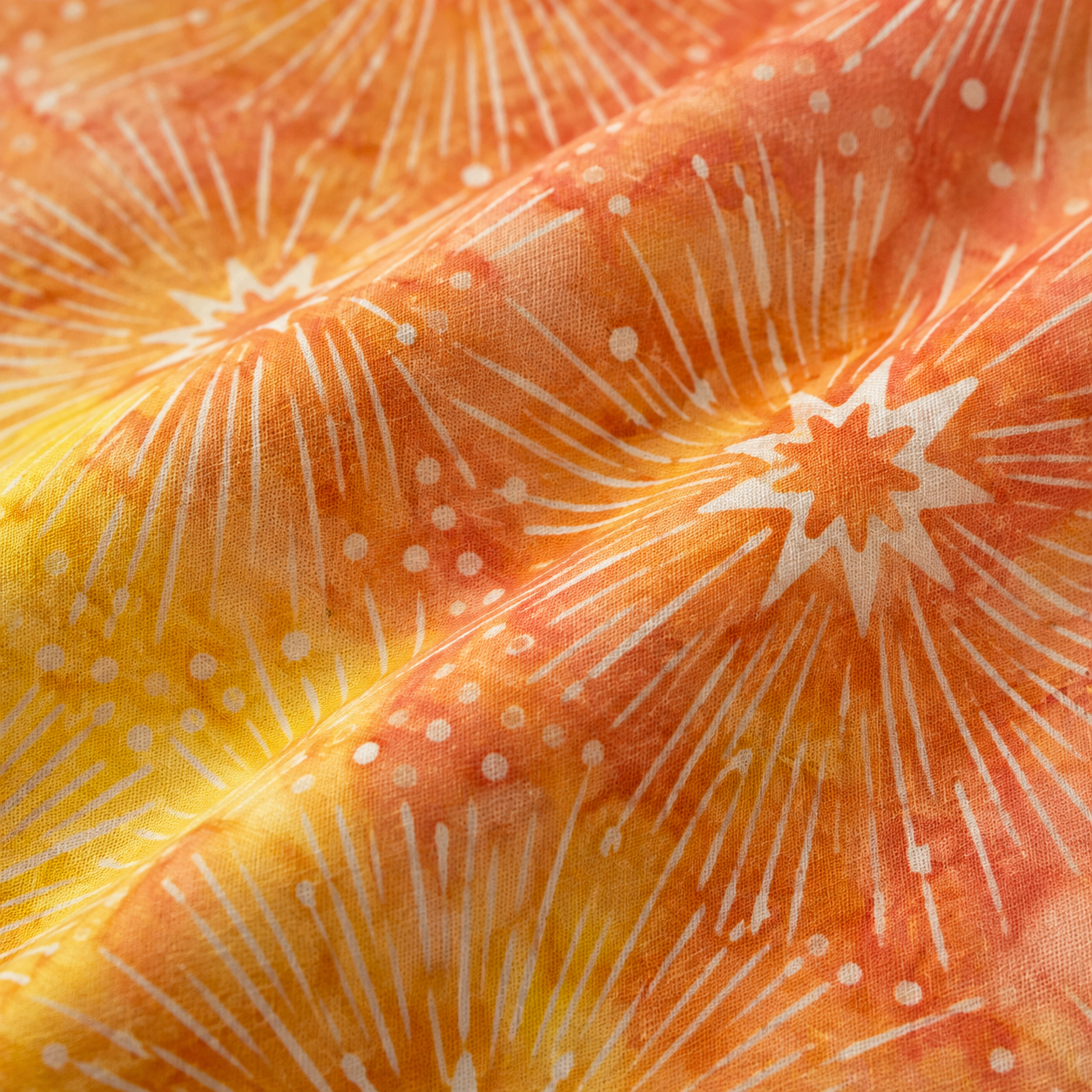 Tela batik algodón 100% estrellas fondo naranja y amarillo